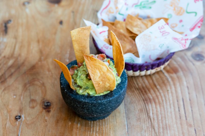 Fresh guacamole with lime and tortilla chips